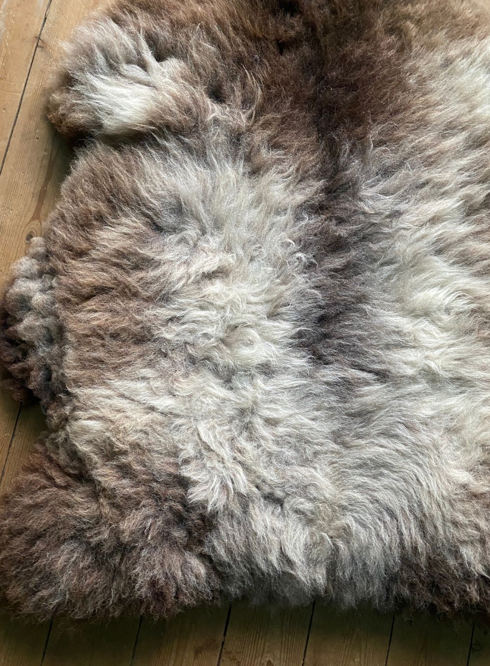 Grey and brown sheepskin rug close up