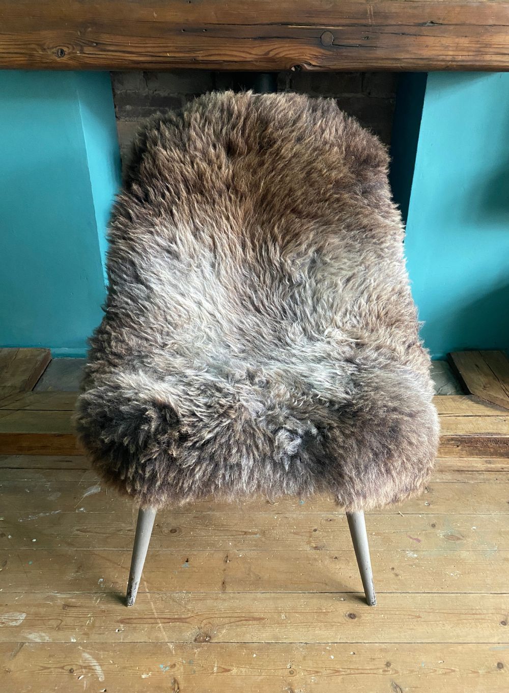 Grey and brown sheepskin rug on chair