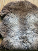 Grey and brown sheepskin rug close up