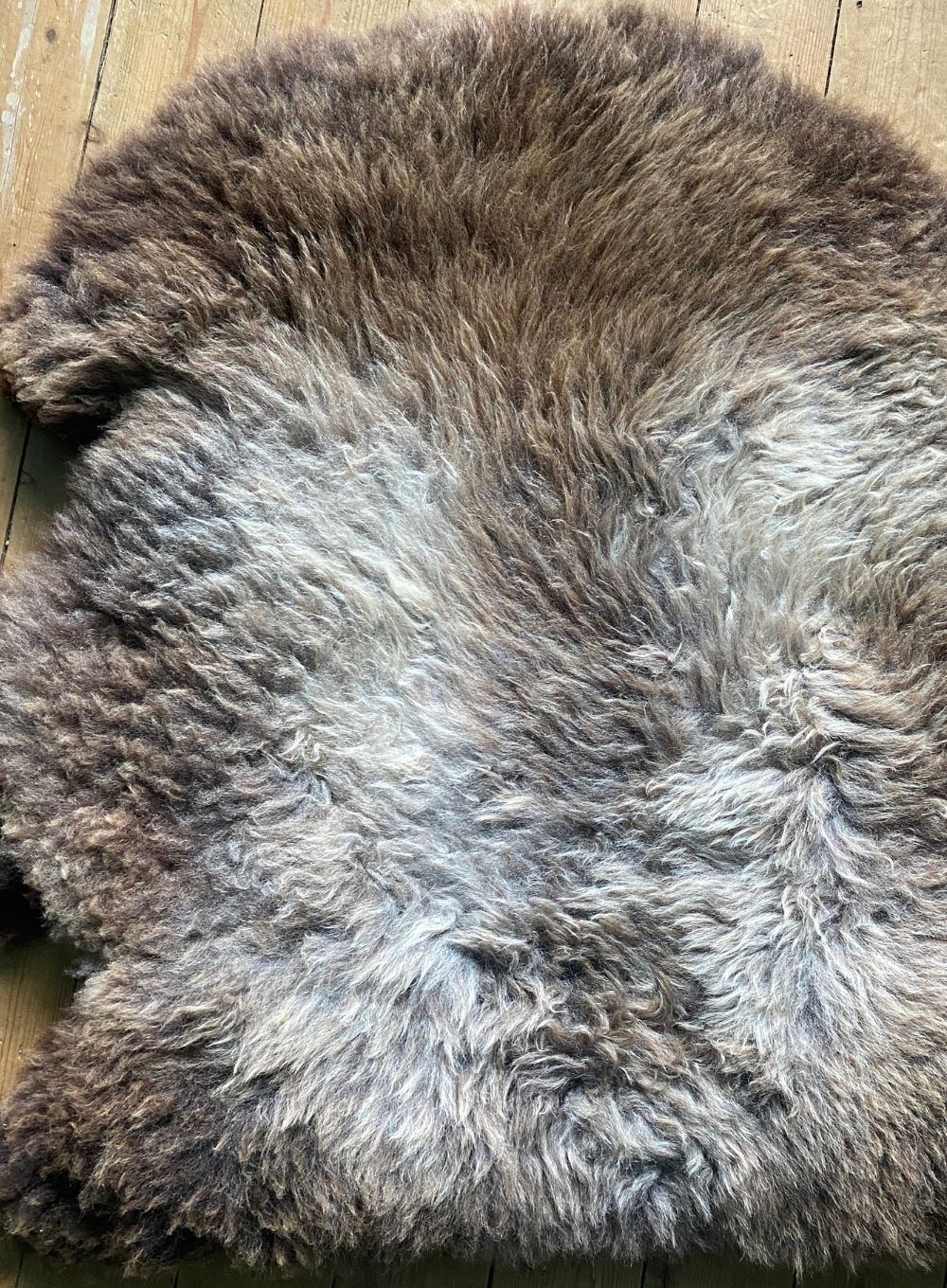 Grey and brown sheepskin rug close up
