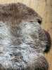 Grey and brown sheepskin rug close up