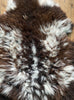 Brown and cream sheepskin rug close up