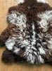 Brown and cream sheepskin rug close up