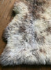 Cream speckled rug close up