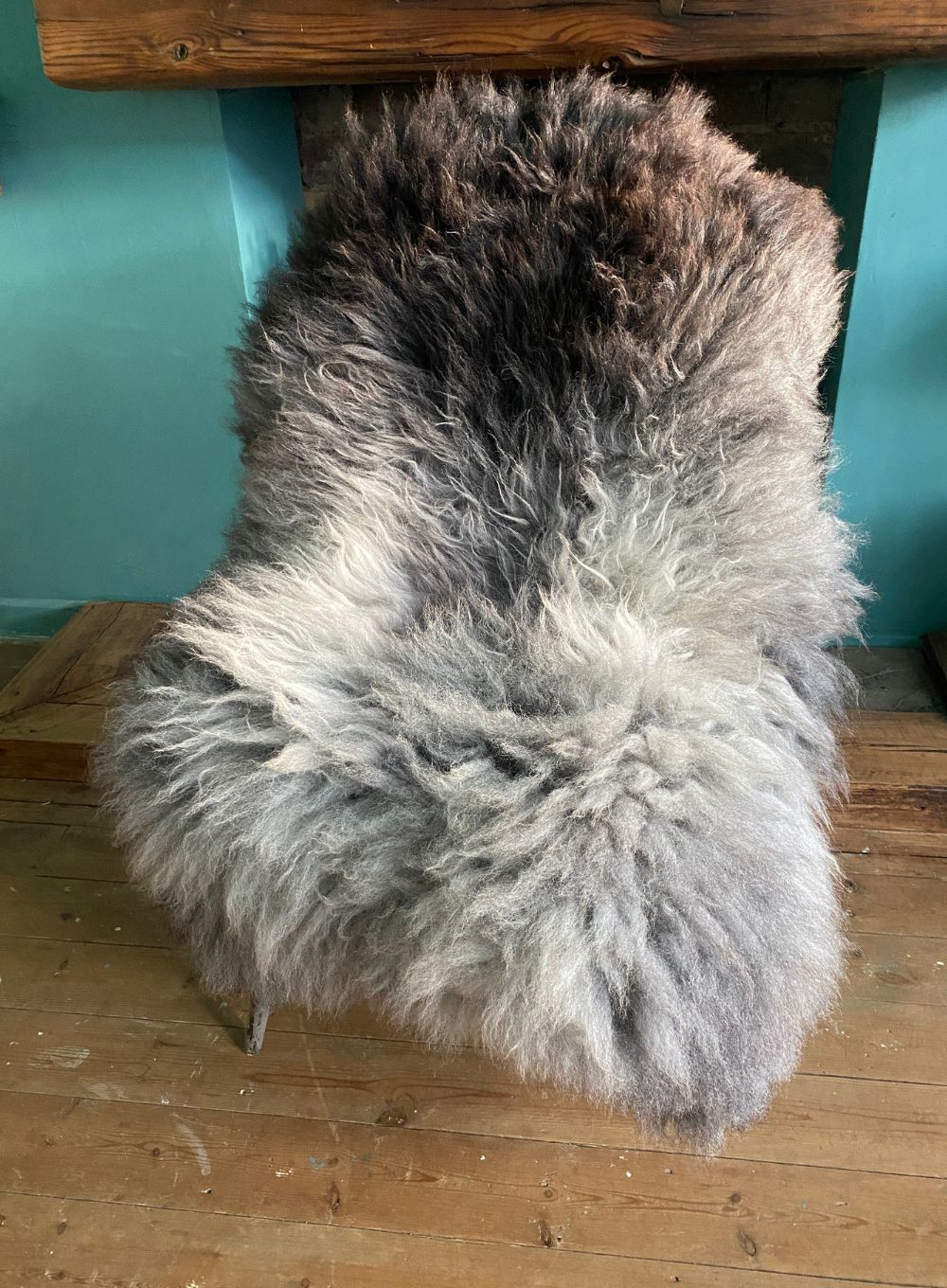 Grey sheepskin rug on chair