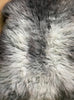 Grey sheepskin rug close up