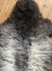 Grey sheepskin rug close up