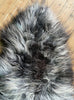 Grey and cream sheepskin rug close up