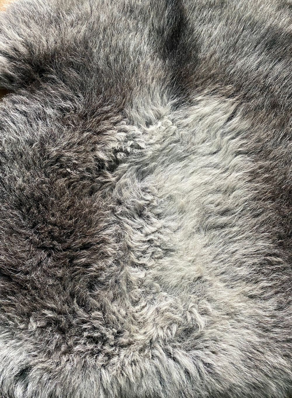 Grey sheepskin rug close up