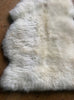 Cream sheepskin rug close up
