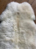 Cream sheepskin rug close up