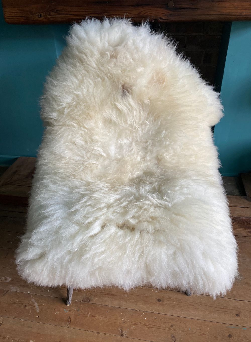 Cream sheepskin rug on chair
