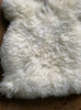 Cream sheepskin rug close up