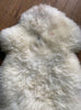 Cream sheepskin rug close up