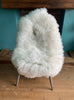 Cream sheepskin rug on chair