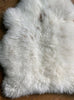 Cream sheepskin rug close up
