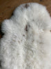 Cream sheepskin rug close up