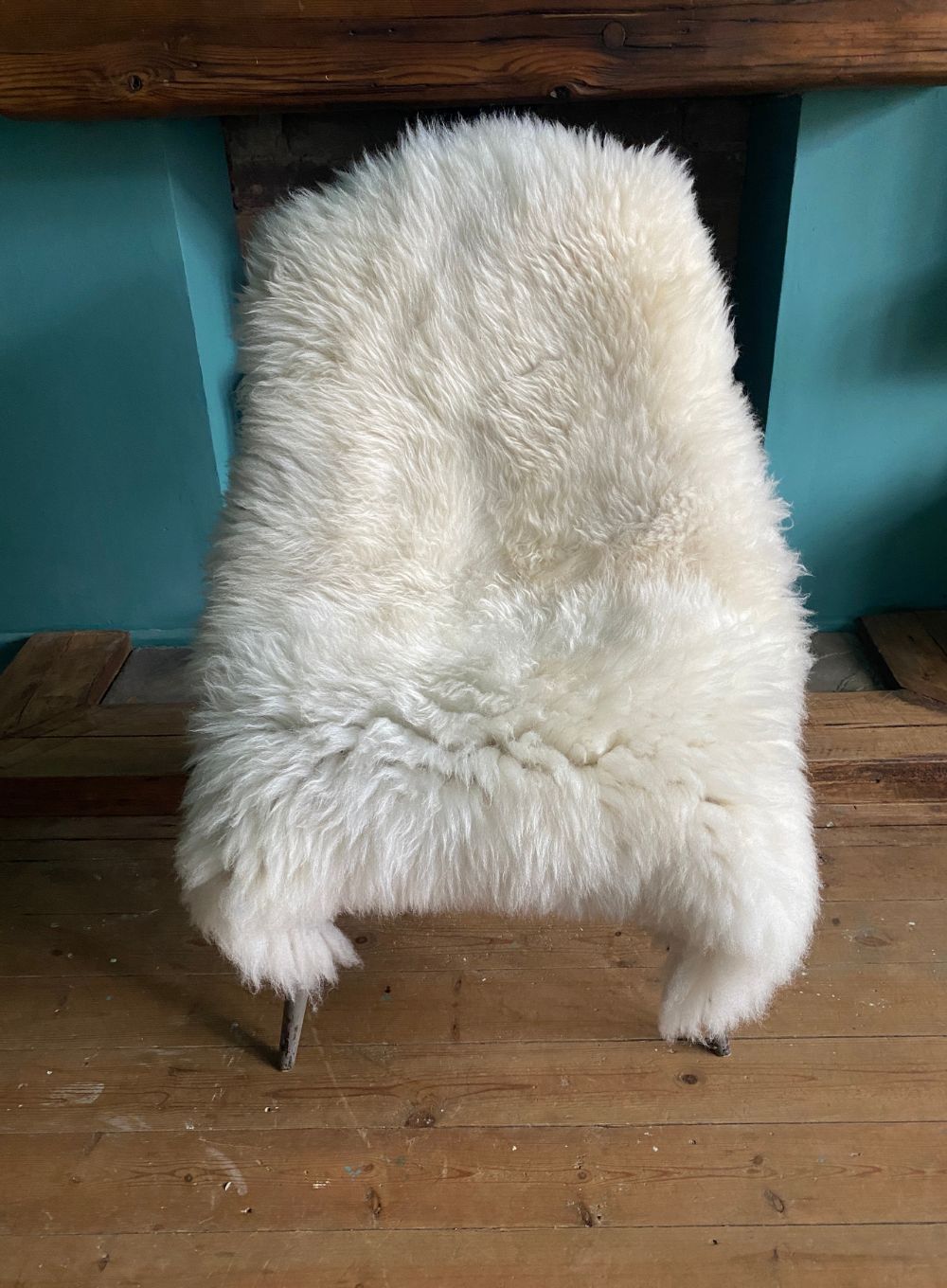 Cream sheepskin rug on chair