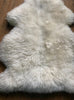 Cream sheepskin rug close up