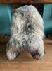 Grey and cream long haired sheepskin rug on chair