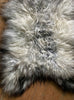 Grey and cream long haired sheepskin rug close up