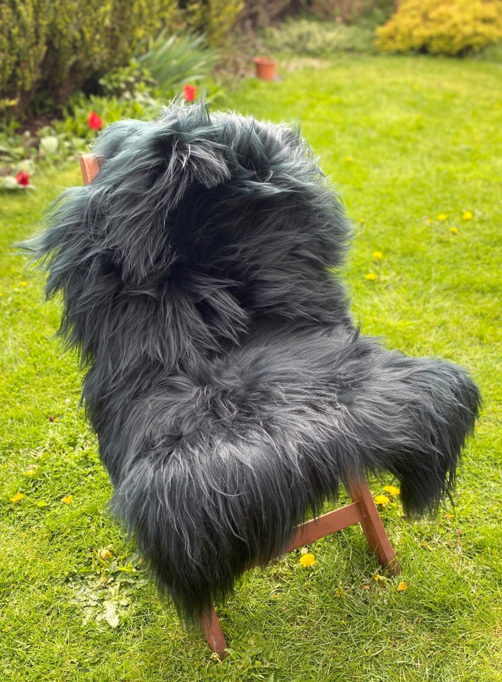 Dark green Icelandic sheepskin rug on chair 