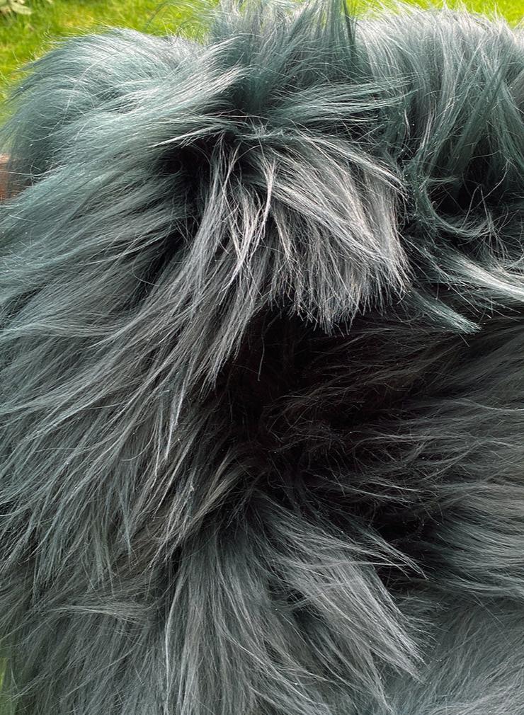 Dark green Icelandic sheepskin rug close up 