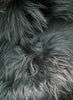 Dark green Icelandic sheepskin rug close up 