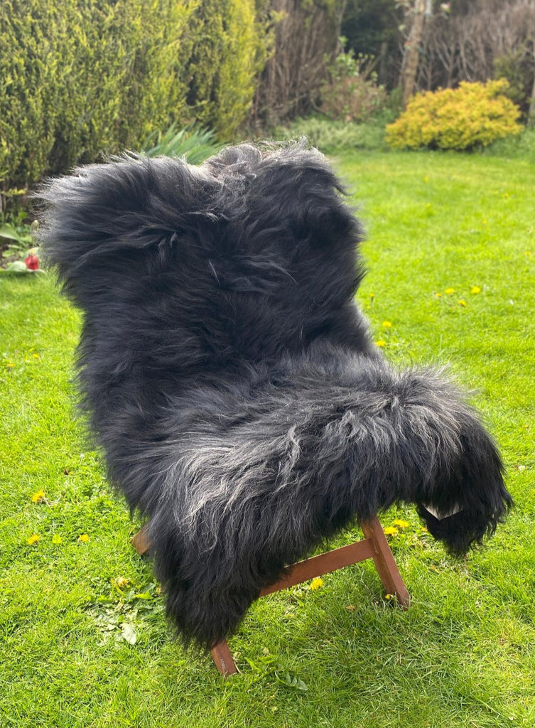 Black Icelandic sheepskin rug on chair