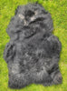 Black Icelandic sheepskin rug laid flat