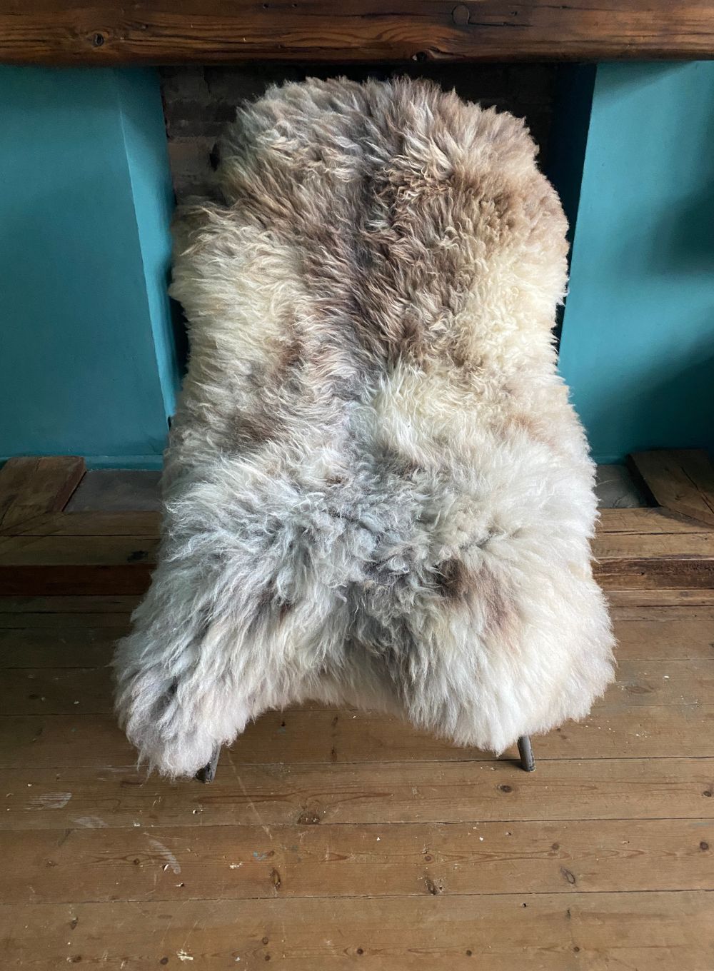 Cream speckled rug on chair