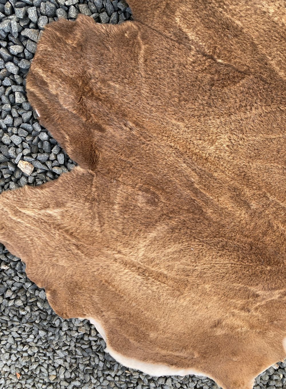 Brown short wooled triple sheepskin rug close up