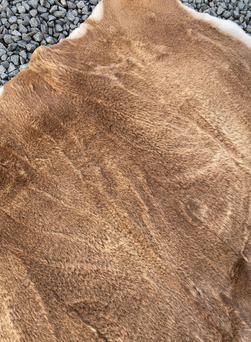 Brown short wooled triple sheepskin rug close up