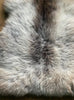 Brown and grey sheepskin rug close up