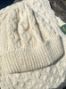 Cream aran beanie and scarf close up