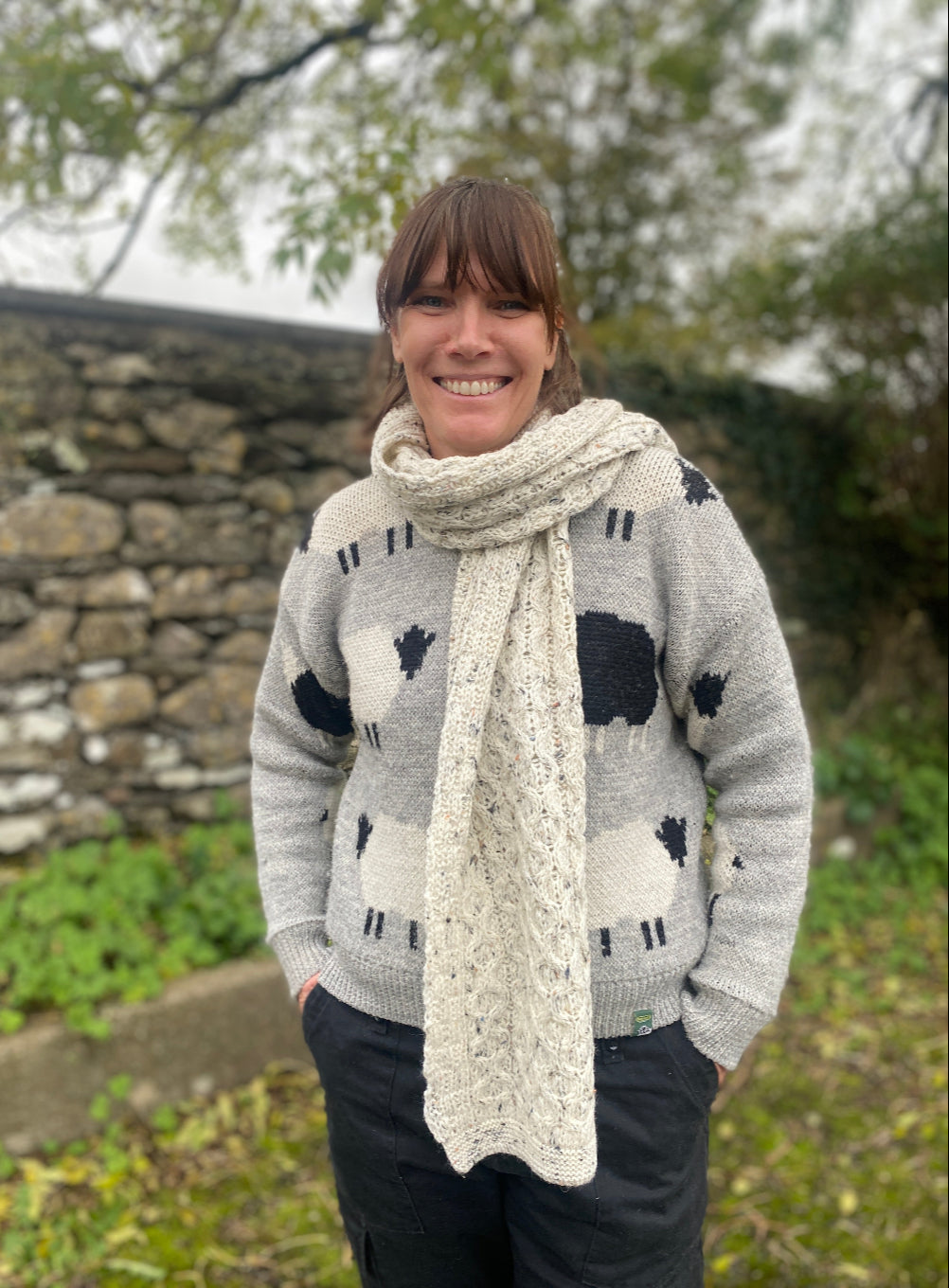 Female wearing wool scarf and jumper