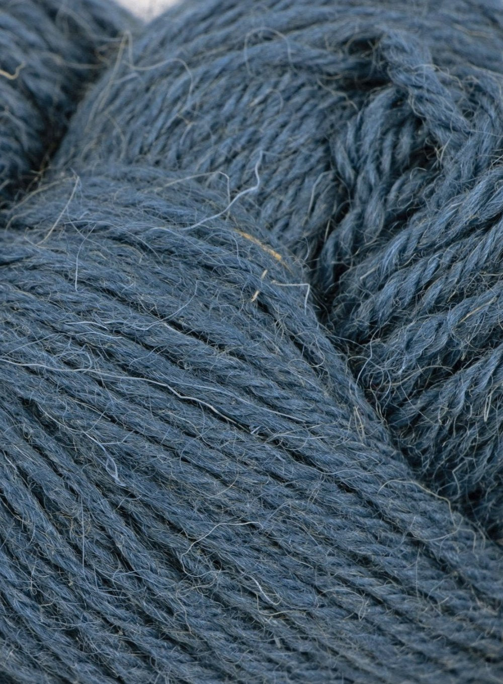 Close up of Clapdale Wool hand knit hank in blue colour