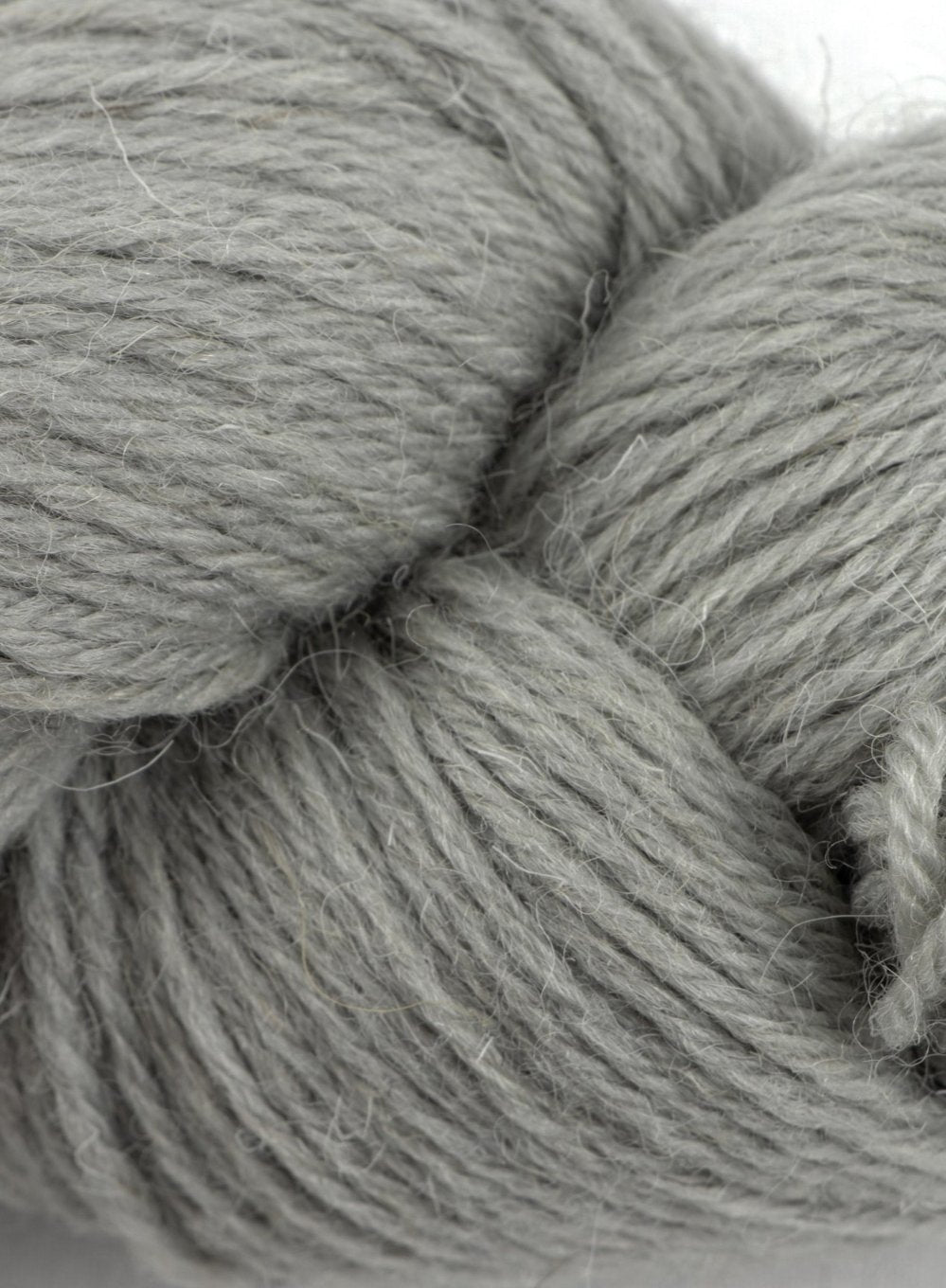 Close up of Clapdale Wool hand knit hank in light grey colour