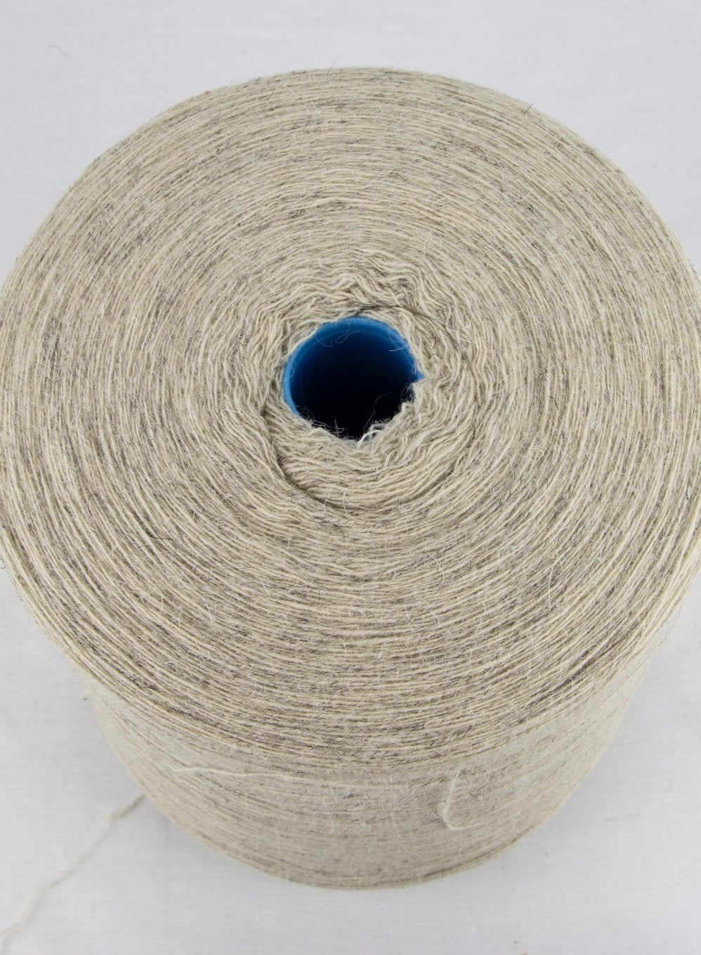 Top view of Clapdale Wool on a 3kg cone - cream nep yarn for weaving