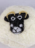 Close up of felted laundry ball with sheep face